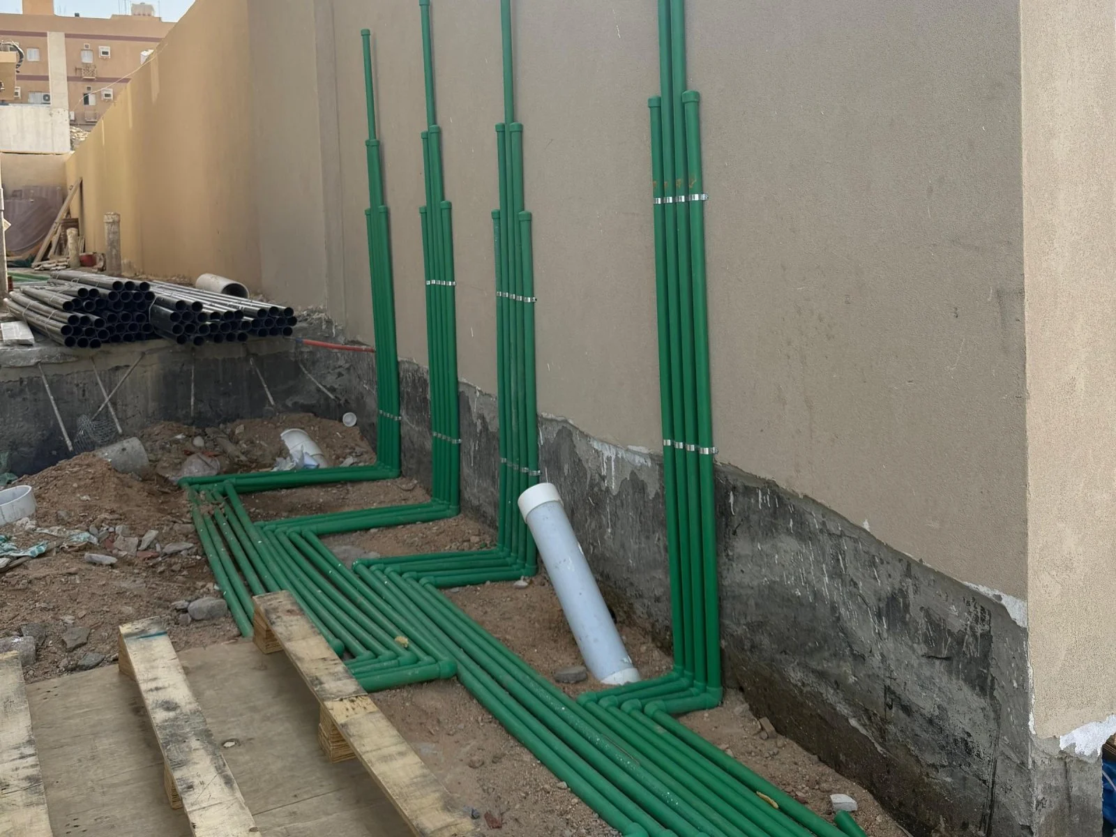 Plumbing and water supply pipework on a wall under construction